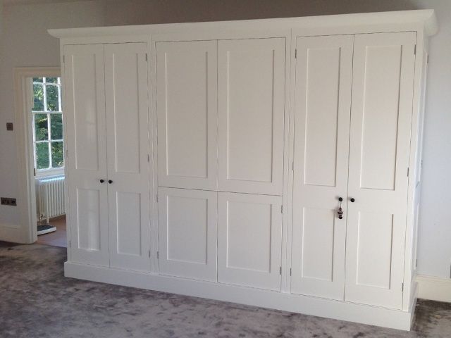 Contemporary fitted bedroom with neutral tones