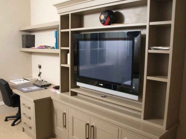 Bedroom with built-in shelves and desk area