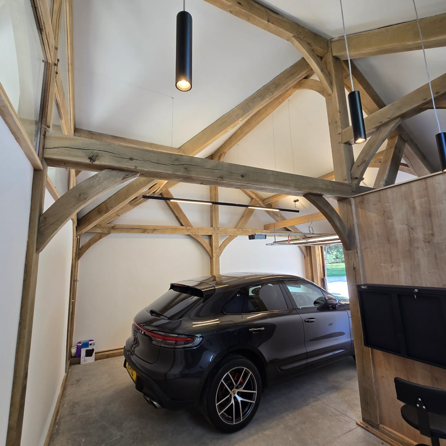 Oak-framed garage or carport by Woodstyle Joinery