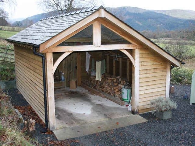 Garage with timber cladding and double doors